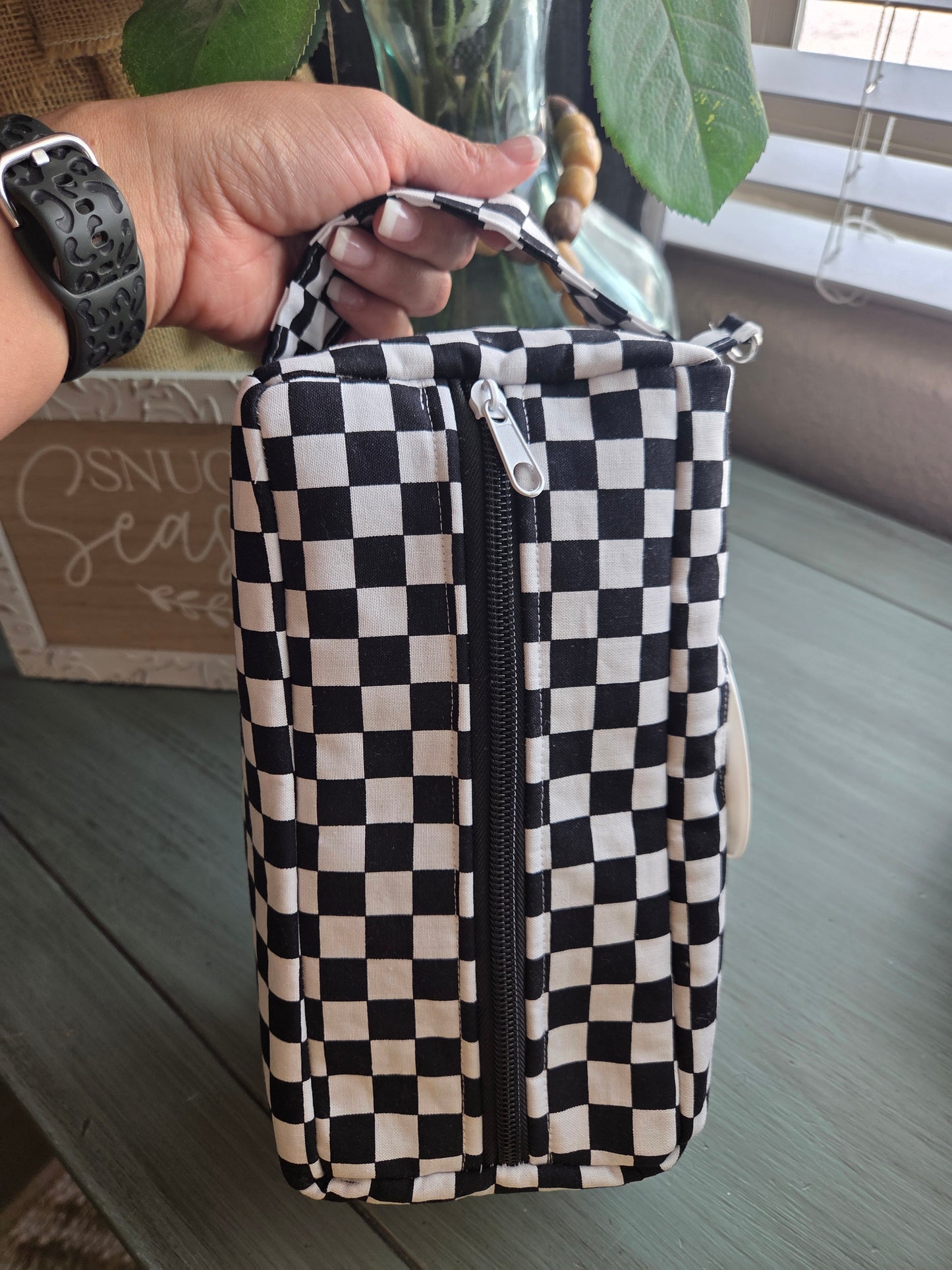 Black and white checkered diaper and wipe pouch