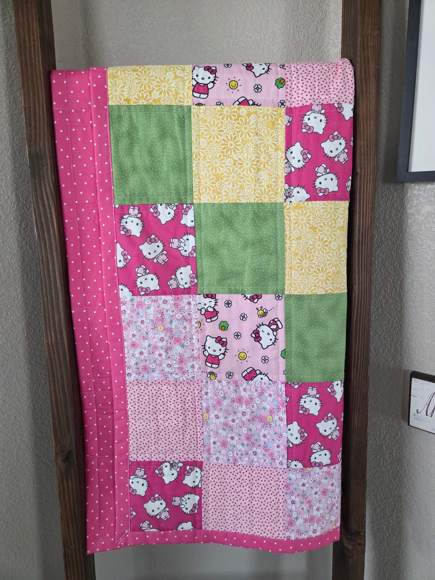 Hello Kitty theme baby/toddler quilt.