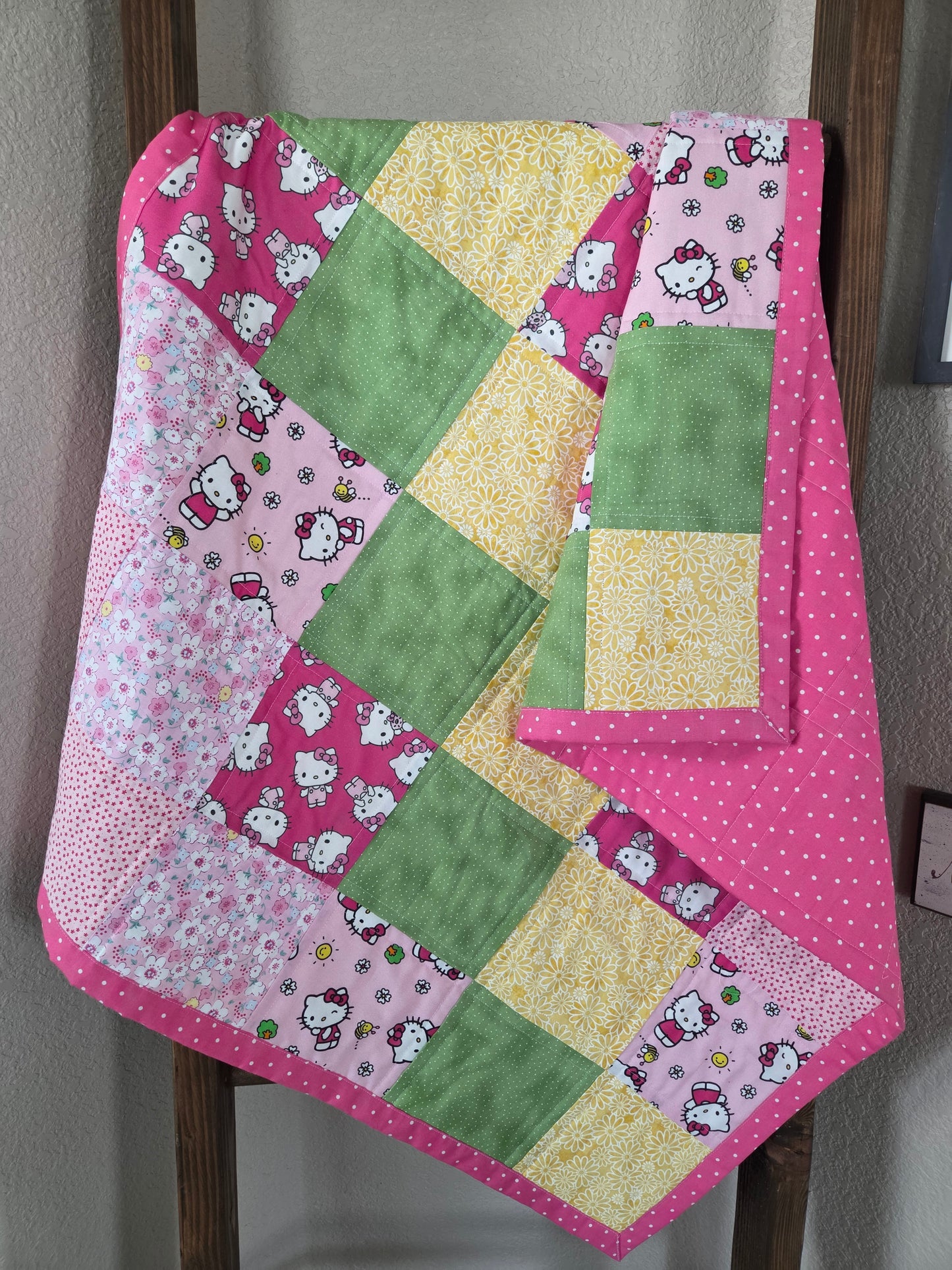 Hello Kitty theme baby/toddler quilt.