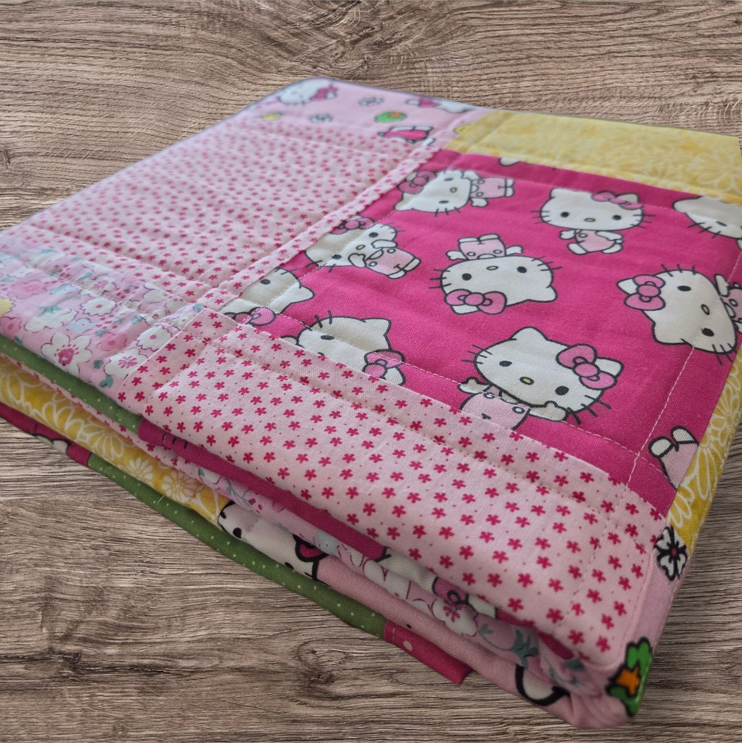 Hello Kitty theme baby/toddler quilt.